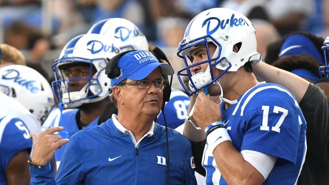 Duke head coach David Cutcliffe speaks with quarterback Daniel Jones (17) in the first quarter after a series of plays. Duke opened the 2018 football season with a win against Army 34-14 at Wallace Wade Stadium in Durham, N.C., Friday, August 31, 2018.