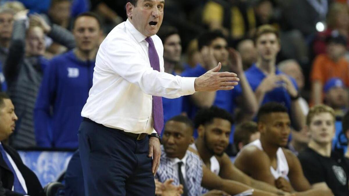 Duke head coach Mike Krzyzewski instructs his team during the second half of Duke's 69-65 victory over Syracuse in the Midwest Regional Semifinal at CenturyLink Center in Omaha, Neb. Friday, March 23, 2018.