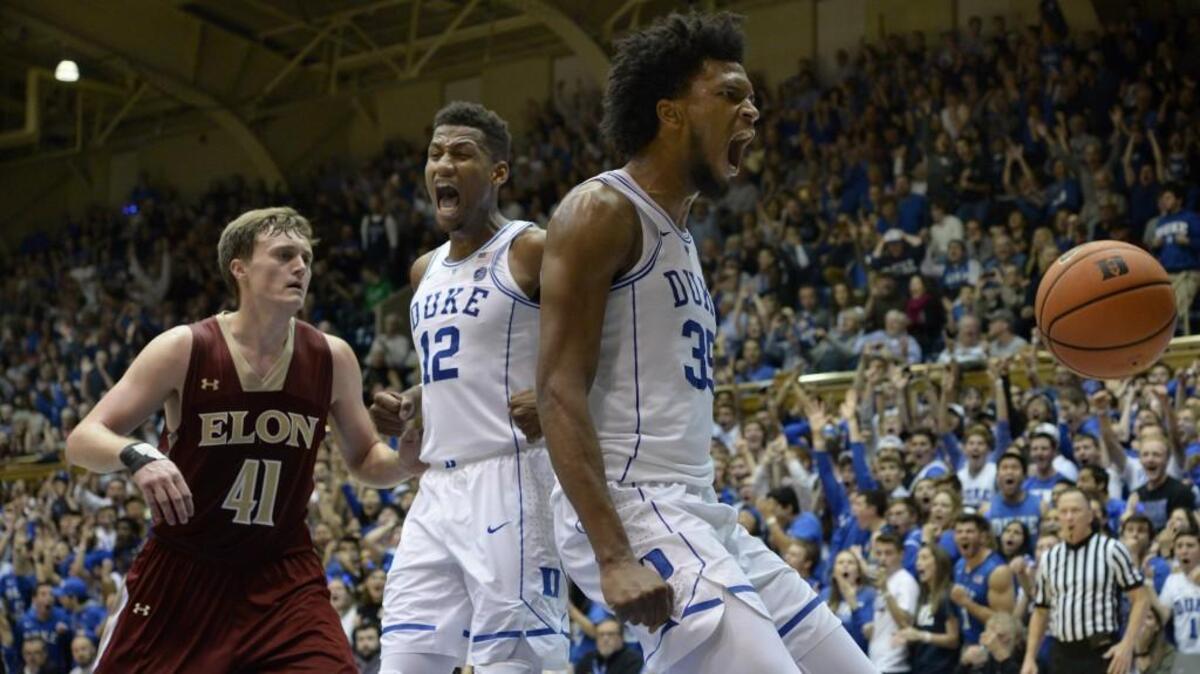 Duke forward Marvin Bagley III (35) and teammate forward Javin DeLaurier (12) react after a massive first half dunk over Elon forward Tyler Seibring (41). Duke played Elon in their season opener at Cameron Indoor Stadium in Durham, N.C. Friday, Nov. 10, 2017.