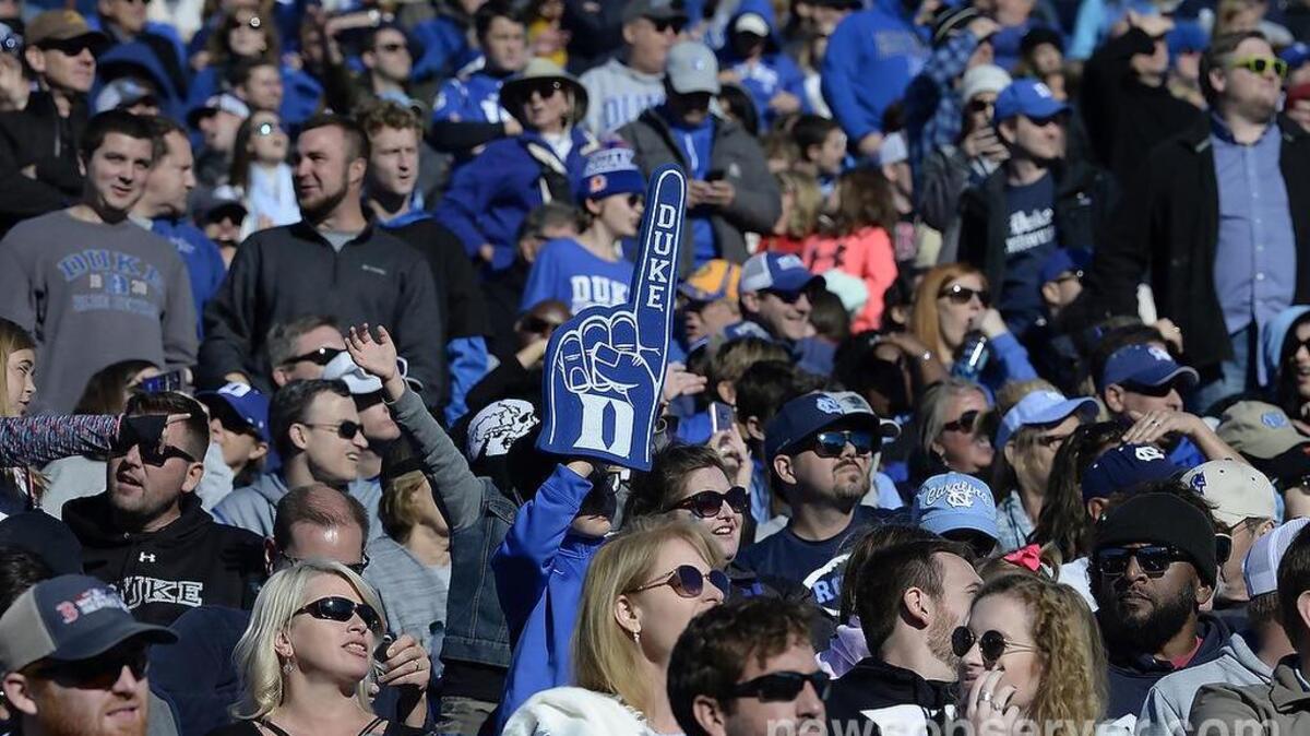 A Duke fan holds up a #1 foam finger as the clock runs out on UNC. Duke defeated UNC 42-35 at Wallace Wade Stadium In Durham, N.C., Saturday, Nov. 10, 2018
