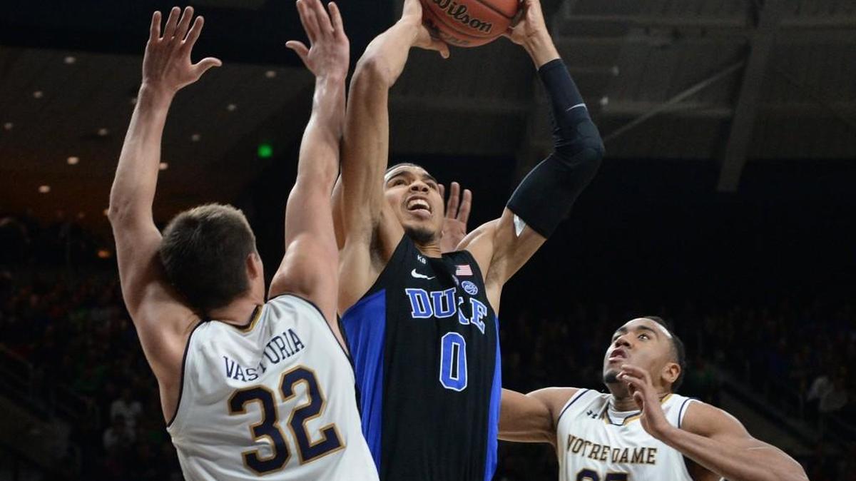 Duke forward Jayson Tatum (0) grabs a rebound over Notre Dame guard Steve Vasturia (32) and forward Bonzie Colson (35). Duke beat Notre Dame 84-74 on Jan. 30. The two teams play again Saturday night in the ACC tournament final.