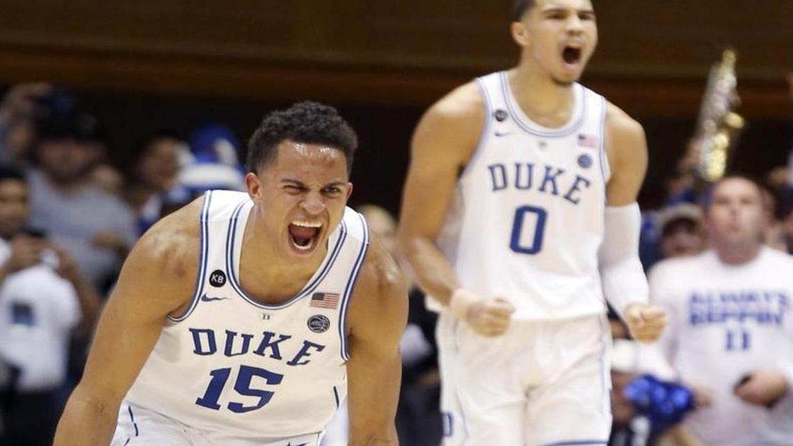 Duke's Frank Jackson (15) and Jayson Tatum (0) celebrate during the second half of the Blue Devils' 70-58 victory over Miami at Cameron Indoor Stadium.