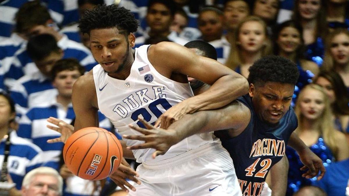 Duke center Marques Bolden (20) and Virginia State's Matt Murphy (42) vie for a second half rebound. Duke beat Virginia State 90-59 at Cameron Indoor Stadium in Durham, N.C. Oct. 28, 2016.