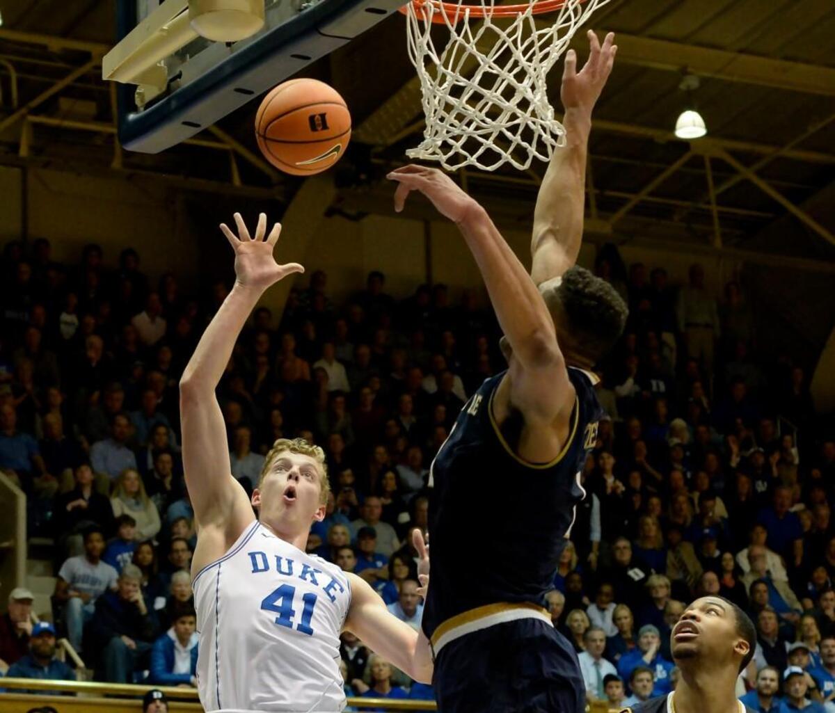 Duke forward Jack White (41) lofts a ball to score over Notre Dame forward Austin Torres (1) in the second half of play. Duke beat Notre Dame 88-66 at Cameron Indoor Stadium In Durham, N.C., Monday, Jan. 29, 2018