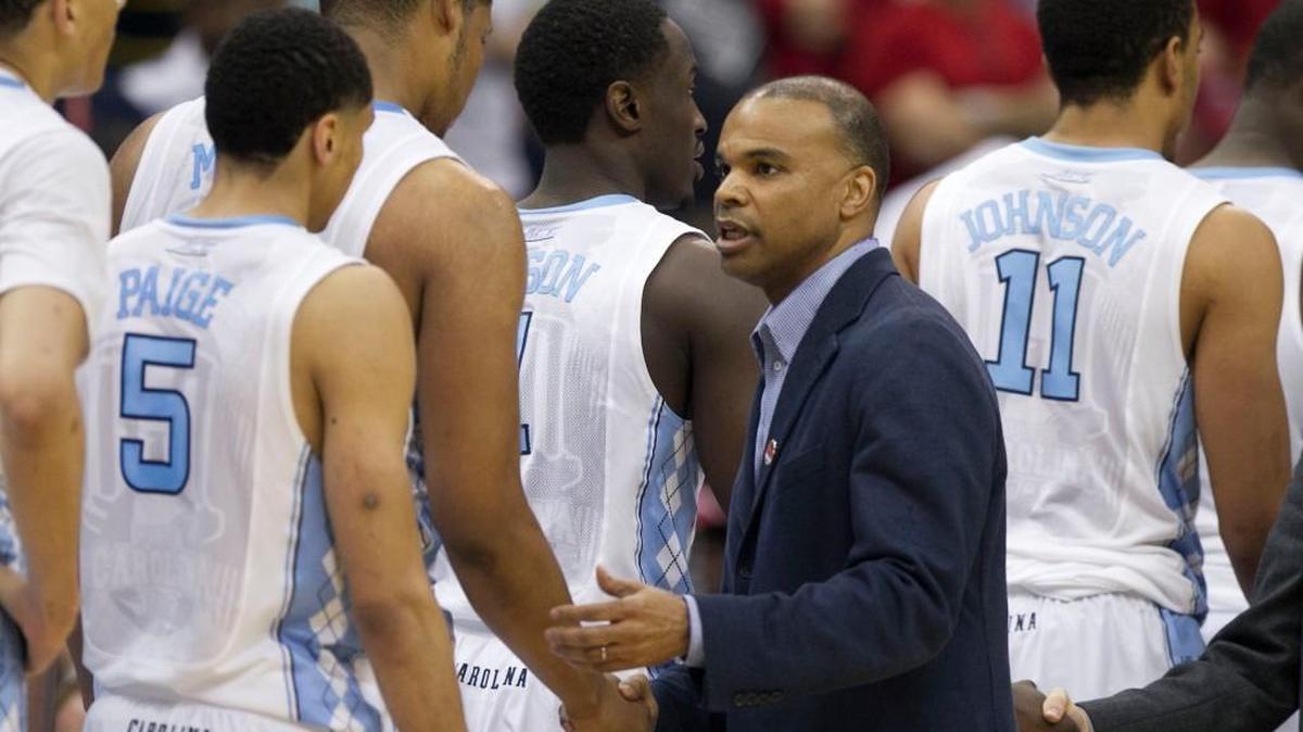 Harvard coach Tommy Amaker shakes hands with North Carolina’s Kennedy Meeks following the Tar Heels’ 67-65 victory on March 19, 2015 at the Jacksonville Veterans Memorial Arena in Jacksonville, Fla.