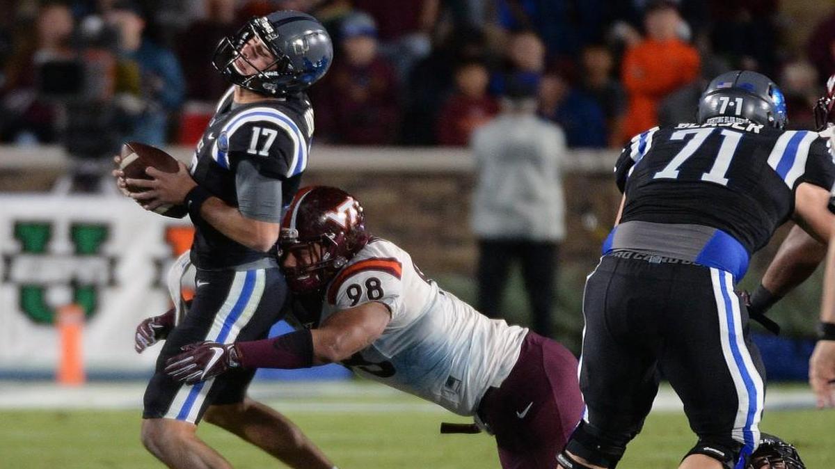 Duke quarterback Daniel Jones (17) gets sacked by Virginia Tech defensive tackle Ricky Walker (98) in the fourth quarter.