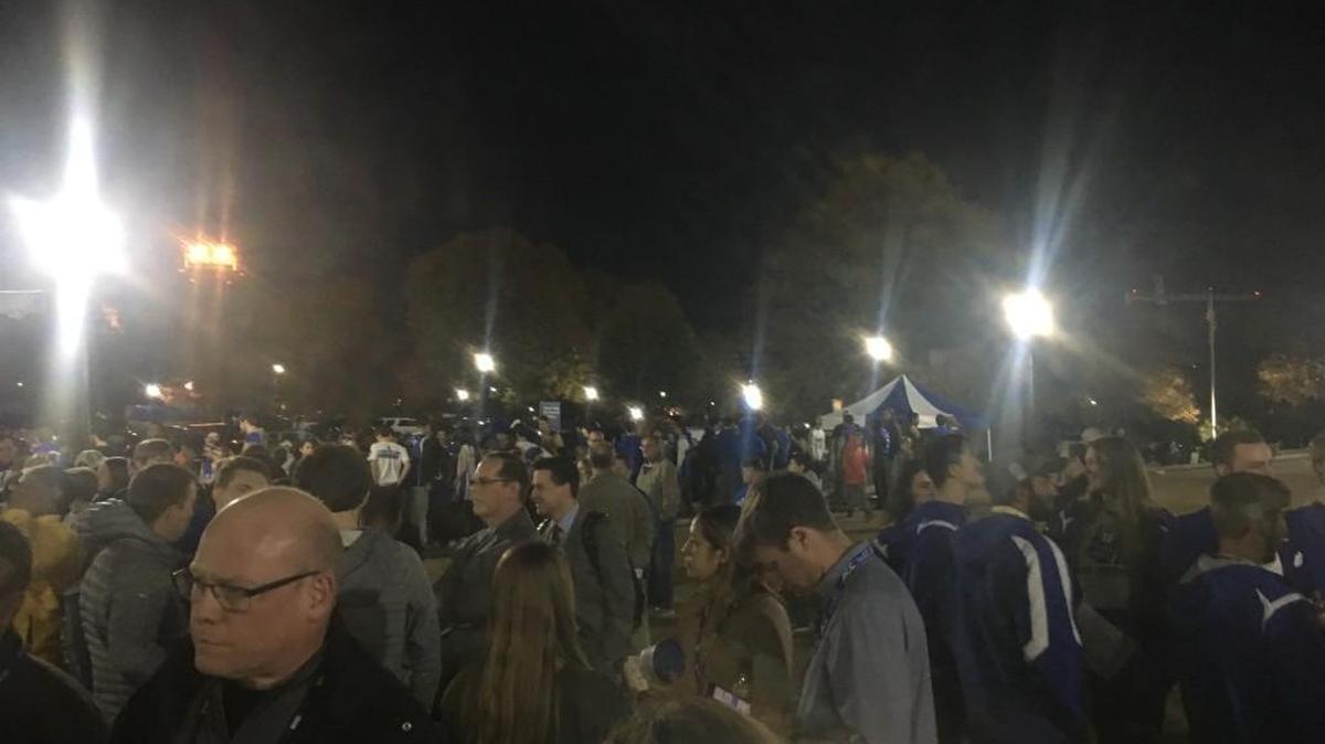 A crowd stands outside Cameron Indoor Stadium after the building was evacuated on Monday before Duke’s basketball game against Furman.