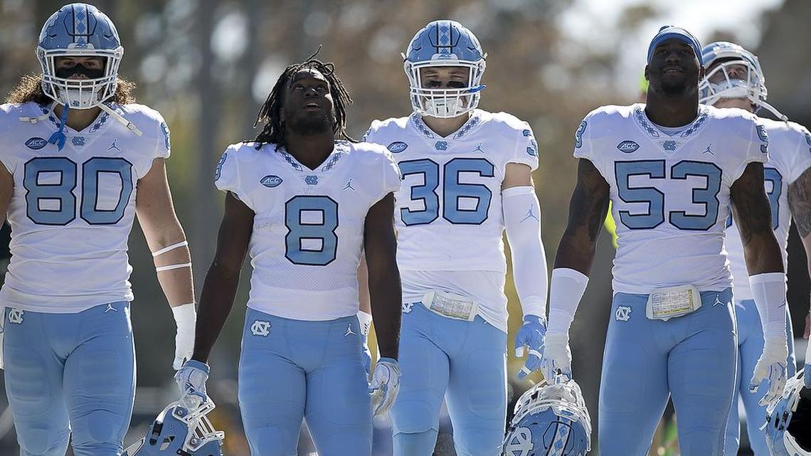 North Carolina’s Jake Bargas (80), Michael Carter (8), Cole Holcomb (36) and Malik Carney (53) enter Wallace Wade Stadium for their game against Duke on Saturday, November 10, 2018 at Wallace Wade Stadium in Durham, N.C.