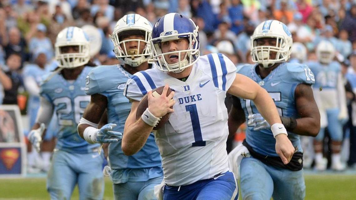 Duke quarterback Thomas Sirk (1) betas the UNC defense in a footrace to score in the second half of play against the Tar Heels. UNC defeated Duke 66-31 at Kenan Stadium in Chapel Hill, N.C. Saturday, November 7, 2015.