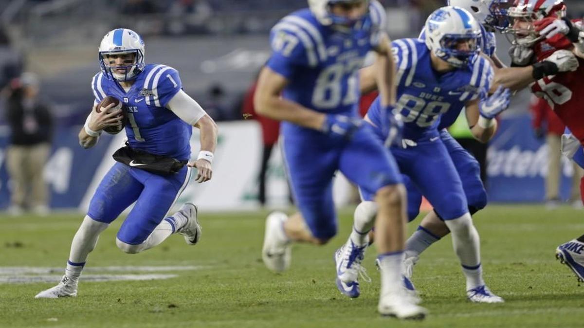 Duke quarterback Thomas Sirk (1) rushes against the Indiana Hoosiers in the first half of the Pinstripe Bowl at Yankee Stadium.