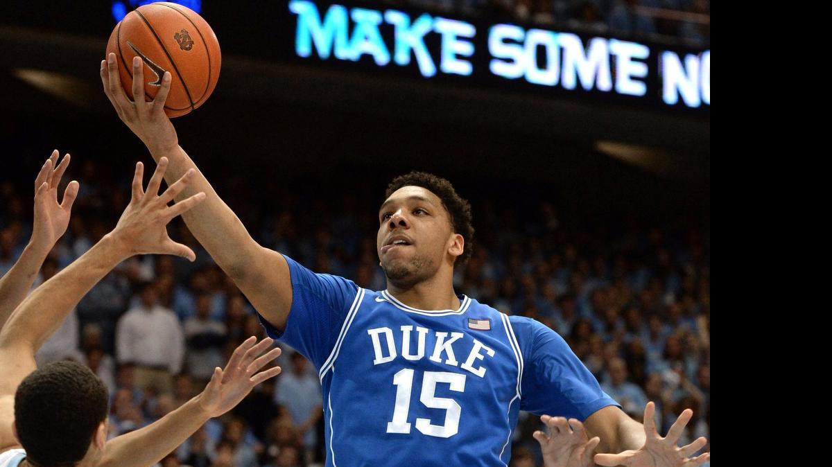 
Duke center Jahlil Okafor (15) goes in for two points in the first half as UNC guard Marcus Paige (5) defends. Duke and UNC battled at the Dean Smith Center in Chapel Hill, NC Saturday, March 7, 2015 in the final game of the regular season. 

