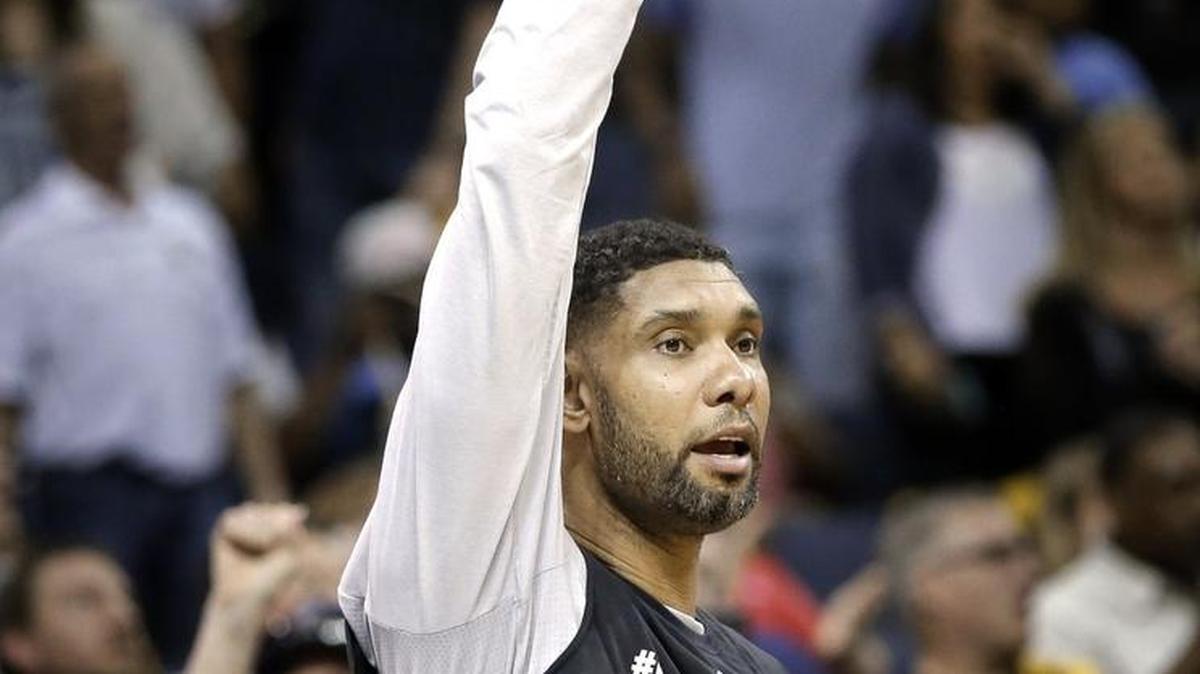 San Antonio Spurs center Tim Duncan cheers from the bench during the second half of Game 4 in a first-round NBA basketball playoff series against the Memphis Grizzlies April 24 in Memphis, Tenn. The Spurs won 116-95 to sweep the series 4-0. (AP Photo/Mark Humphrey)