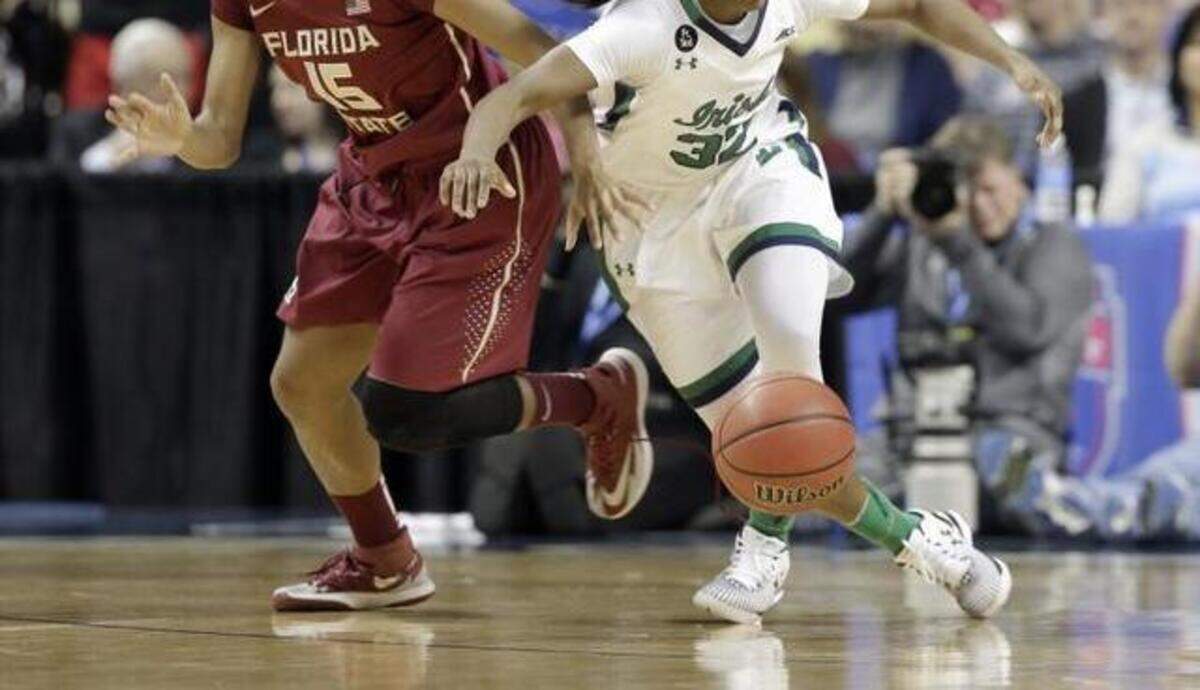 
Notre Dame’s Jewell Loyd and Florida State’s Maegan Conwright battle for the ball during the first half the ACC championship game Sunday at Greensboro Coliseum. Top-seeded Notre Dame beat second-seeded FSU 71-58, and Loyd led the way with 18 points.
