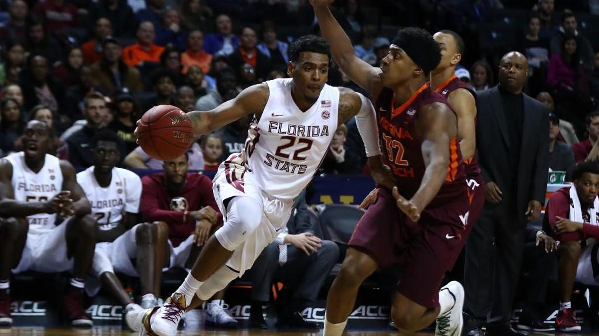 Florida State’s Xavier Rathan-Mayes, left, drives against Virginia Tech’s Zach LeDay on Thursday. The Seminoles use 12 players, depth which helps them wear down other teams.
