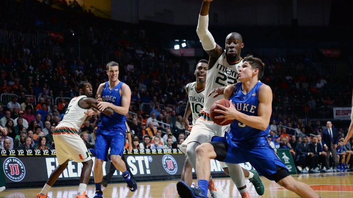 Duke guard Grayson Allen (3) heads for the basket in the first half of play as Miami center Tonye Jekiri (23) defends. Miami defeated Duke 80-69 at the BankUnited Center in Coral Gables, Fl. on Jan. 25.