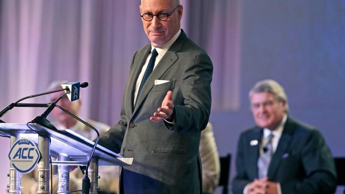 ESPN president John Skipper gestures as he talks about the new ACC/ESPN Network during a news conference at the Atlantic Coast Conference Football Kickoff in Charlotte, N.C., Thursday, July 21, 2016. ACC commissioner John Swofford listens at rear right.