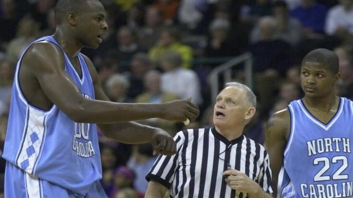 UNC’s Brendan Haywood, left, argues with official John Clougherty as teammate Ronald Curry, right, on Feb. 6, 2001. Clougherty, who will retire as the ACC’s supervisor of basketball officials after the 2015-16 season, says technology has been a game-changer for referees in all sports.