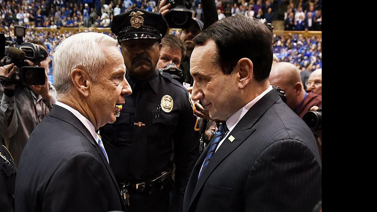 
ACC basketball is “Red Sox-Yankees all the time,” Senior Associate Commissioner for Men’s Basketball Operations Paul Brazeau said. Above, North Carolina head coach Roy Williams, left, and Duke head coach Mike Krzyzewski greet each other before the Feb. 17 game at Cameron Indoor Stadium in Durham. 
