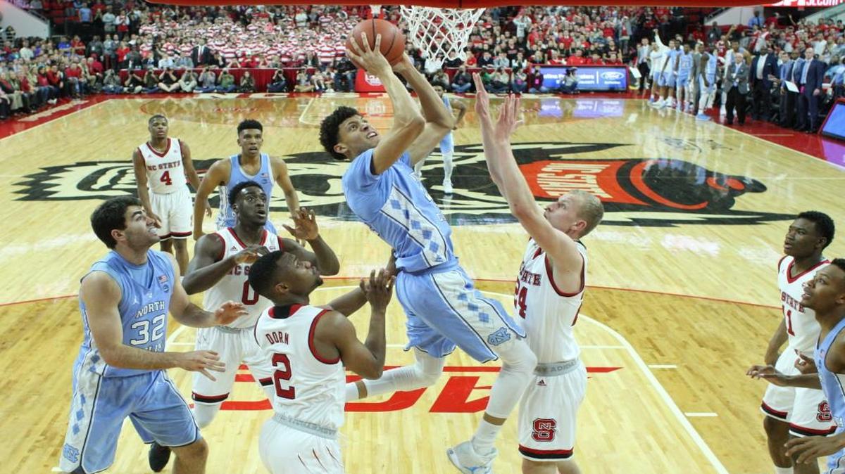 North Carolina’s Justin Jackson (44) shoots as N.C. State’s Torin Dorn (2) and Maverick Rowan (24) defend in UNC’s 97-73 win over N.C. State on Feb. 15.