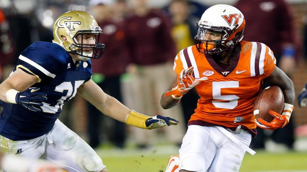 Virginia Tech wide receiver Cam Phillips tries to escape from Georgia Tech linebacker Tyler Marcordes Thursday in Atlanta. The ACC has nine guaranteed bowl spots this year for nine eligible teams.