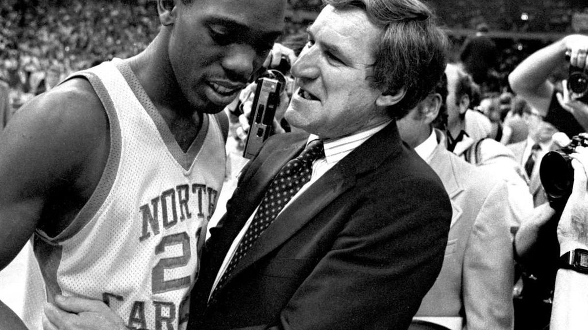 UNC coach Dean Smith congratulates point guard Jimmy Black after the Tar Heels defeated the Georgetown Hoyas to win 1982 National Championship in New Orleans, April 7, 1982.