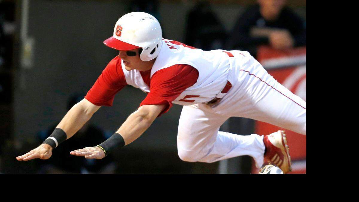
N.C. State's Andrew Knizner (11) slides safely into home during a 2014 game. 
