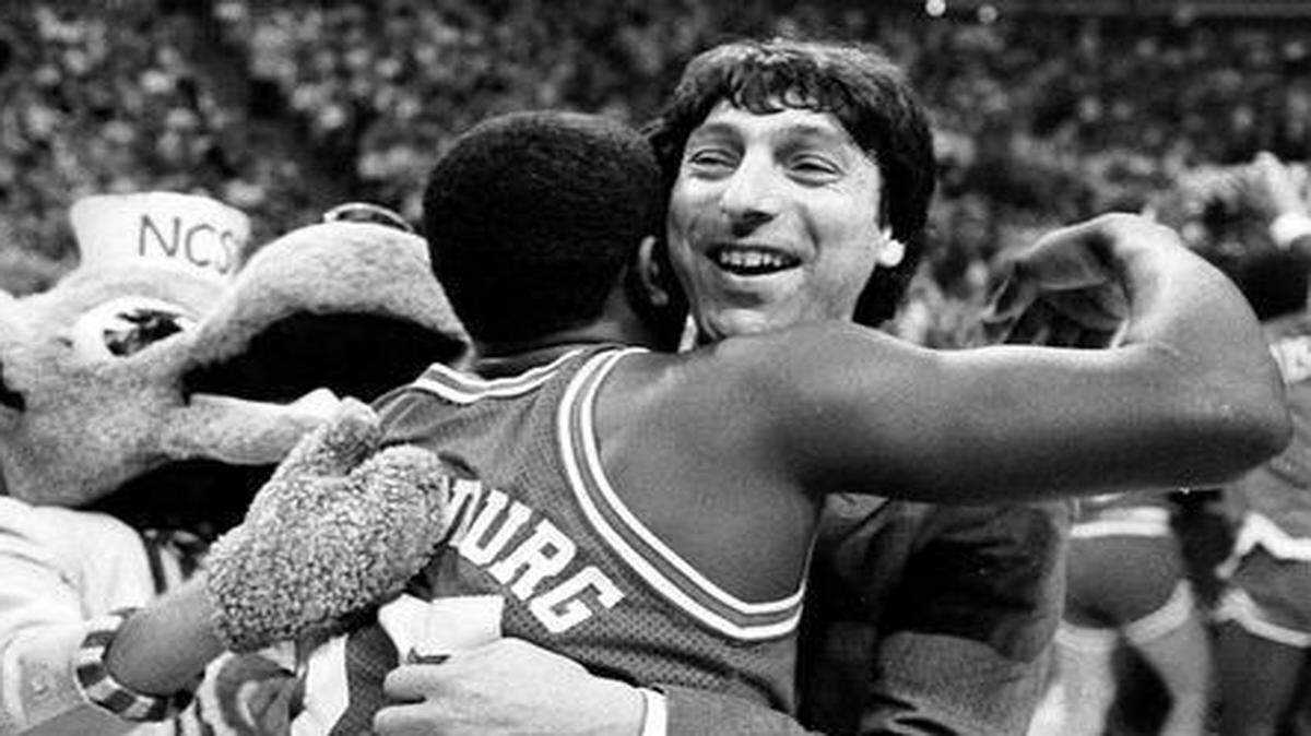 
N.C. State head coach Jim Valvano embraces Dereck Wittenburg as the Wolfpack celebrates their 1983 ACC Tournament championship.
