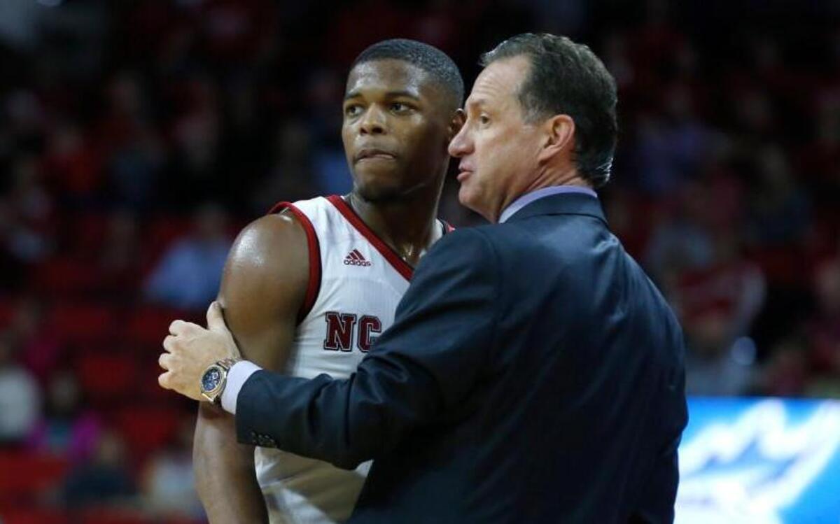 N.C. State's head coach Mark Gottfried talks with Dennis Smith Jr. (4) during 79-74 victory over Pitt at PNC Arena on Jan. 17, 2017.