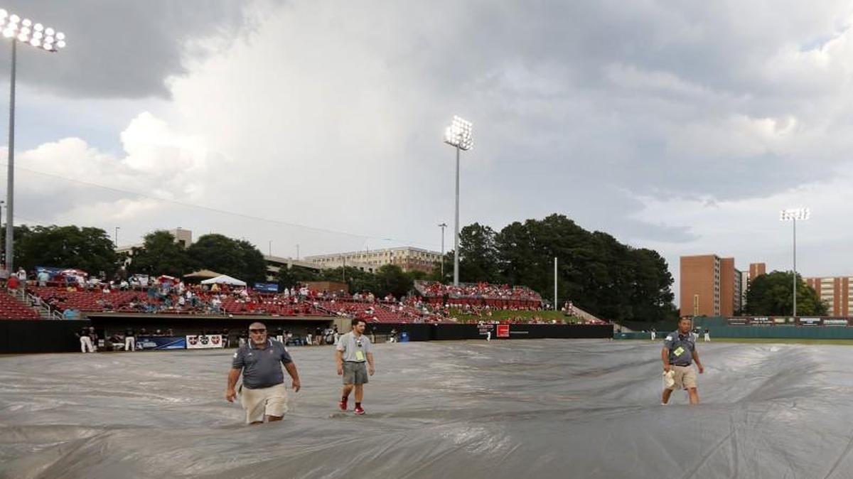 The tarp is brought onto the field during a weather delay before N.C. State's game against Coastal Carolina in the Raleigh Regional of the 2016 NCAA Division I Men’s Baseball Championship at Doak Field.