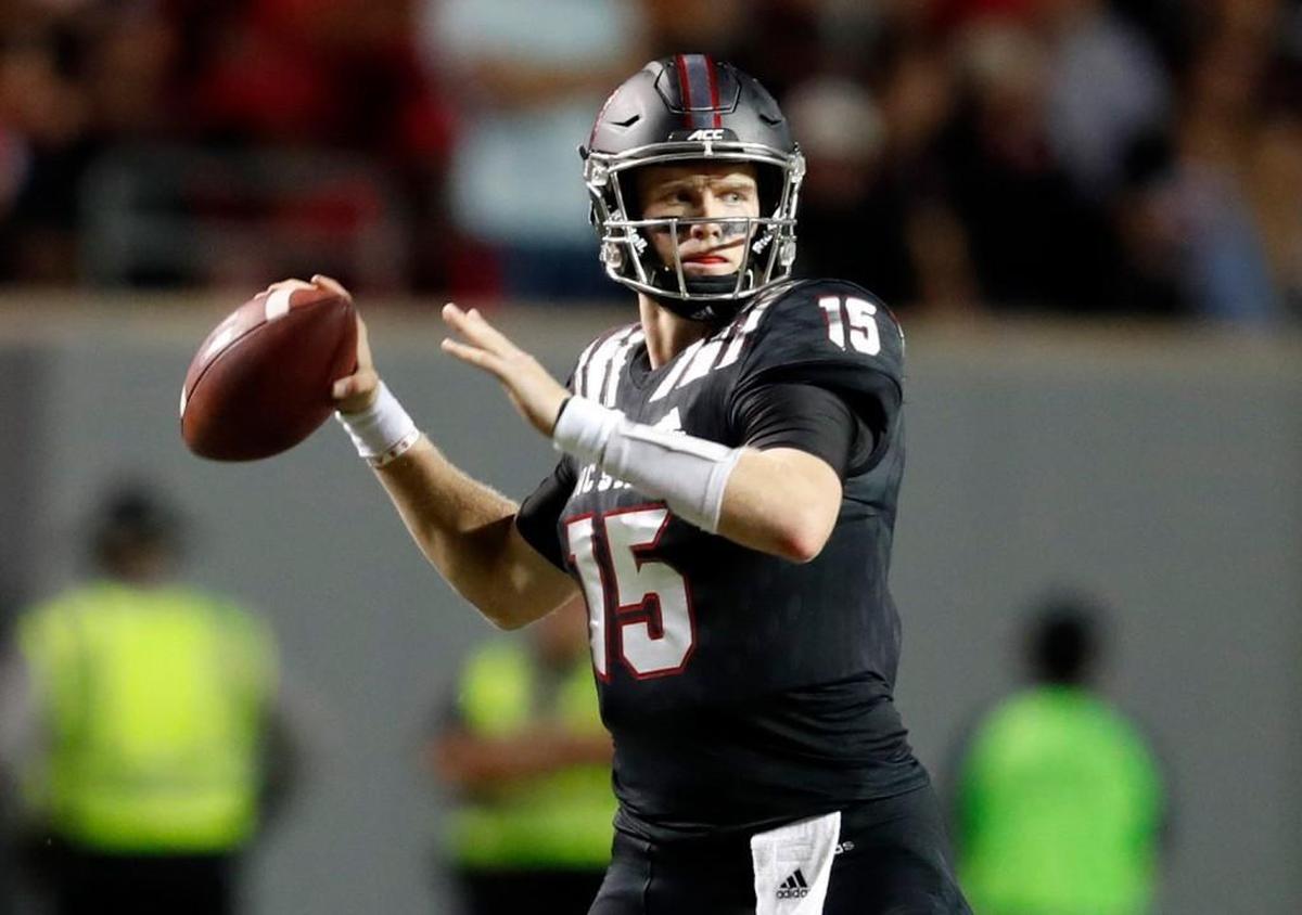 Ryan Finley looks to throw against Louisville in October.