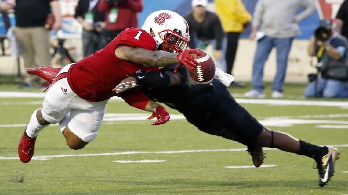 N.C. State tight end Jaylen Samuels (1) dives into the end zone past a Vanderbilt defender for a first-half touchdown in the Independence Bowl in Shreveport, La.