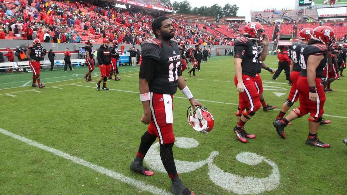 N.C. State quarterback Jacoby Brissett, middle, heads off the field after the Wolfpack lost 20-13 at home to Louisville on Oct. 3. The Wolfpack needs to be Mississippi State in the Dec. 30 Belk Bowl to match last season’s win total.