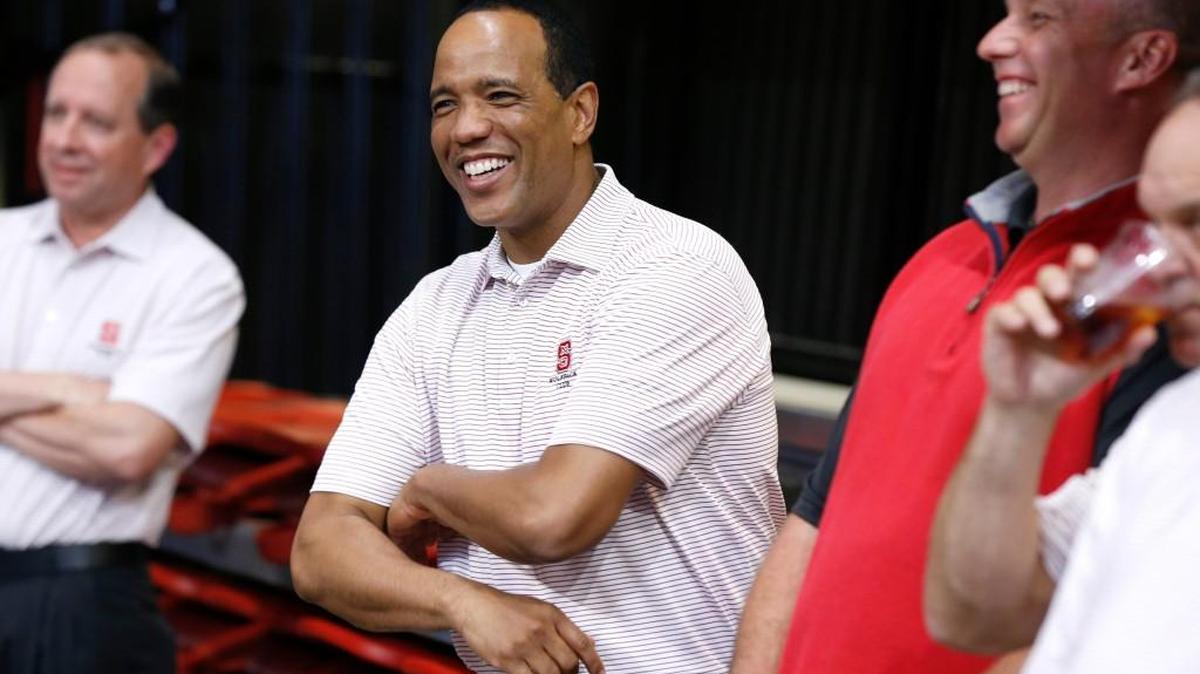 N.C. State men's basketball coach Kevin Keatts, left, laughs with head football coach Dave Doeren during the N.C. State Wolfpack Club Coaches Caravan at Reynolds Coliseum on April 27, 2017.