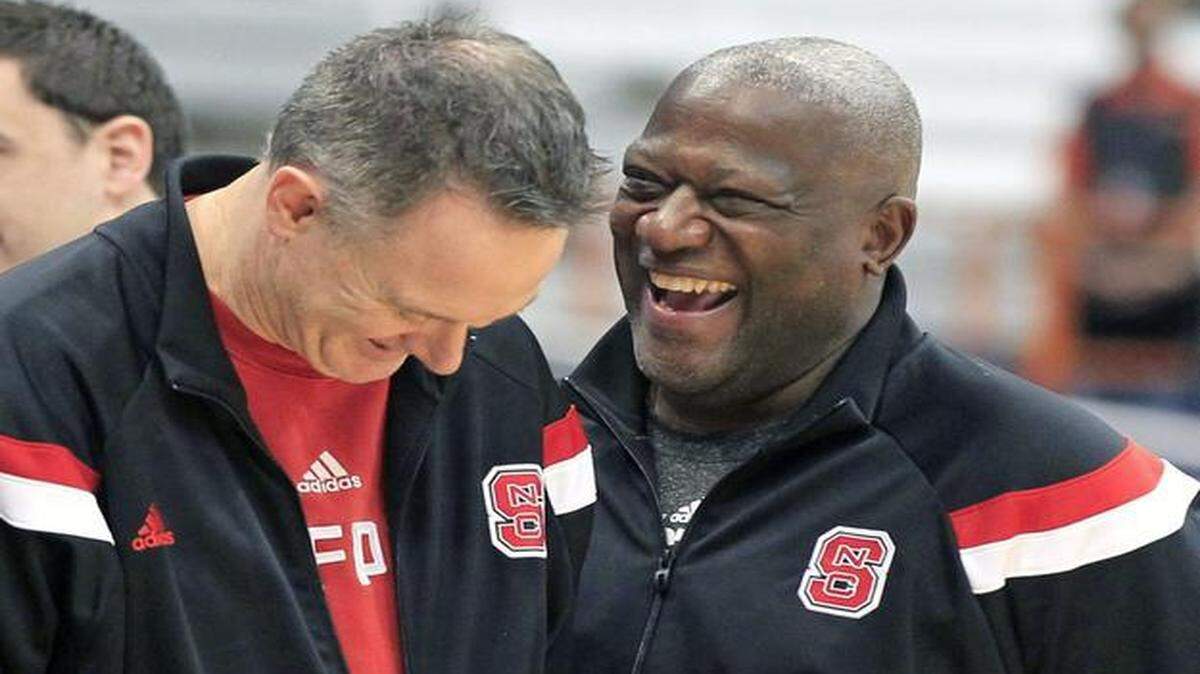 
N.C. State director of player development Dereck Whittenburg, right, laughs with director of operations Jeff Dunlap during practice for the 2015 NCAA Men's Basketball East Regionals at the Carrier Dome in Syracuse, N.Y., Thursday, March 26, 2015. The Wolfpack will face Louisville on Friday.
