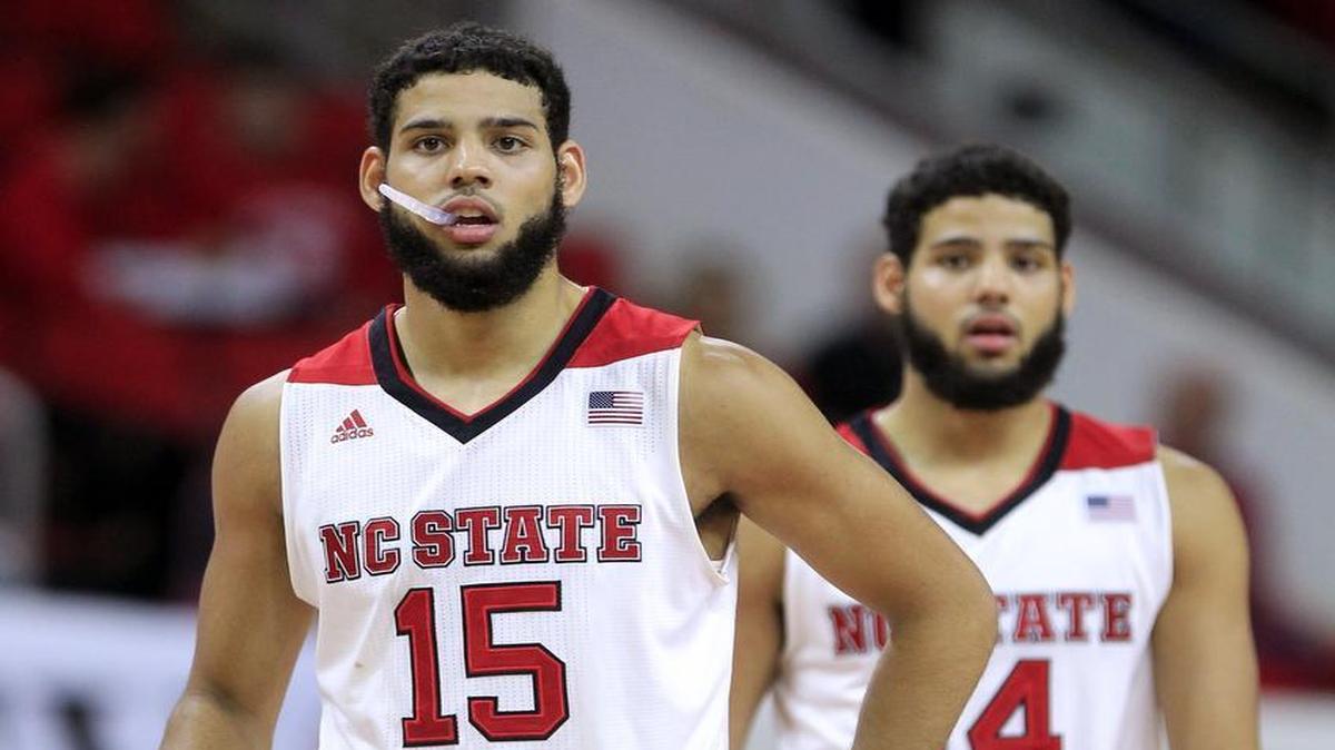 N.C. State's Cody Martin (15) and Caleb Martin (14) head back onto the court after a timeout during the first half of the Wolfpack's exhibition game against Cal State Los Angeles at PNC Arena on Nov. 8, 2015.