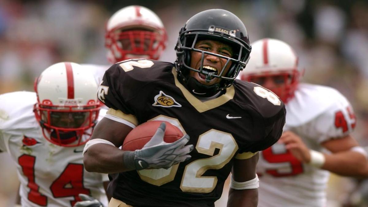 Wake Forest redshirt freshman Willie Idlette (82) outruns, N.C. State's (14) Dovonte Edwards, and (45) Ernest Jones to score a touchdown on a punt return in the second quarter of play on September 6, 2003 in Groves Stadium in Winston-Salem, N.C.