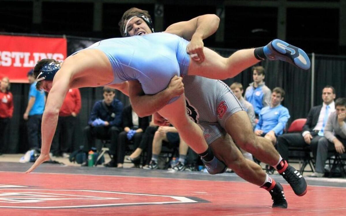N.C. State's Nick Gwiazdowski, right, wrestles UNC's Cory Daniel during an ACC dual match at Dorton Arena in Raleigh. Gwiazdowski won his match.