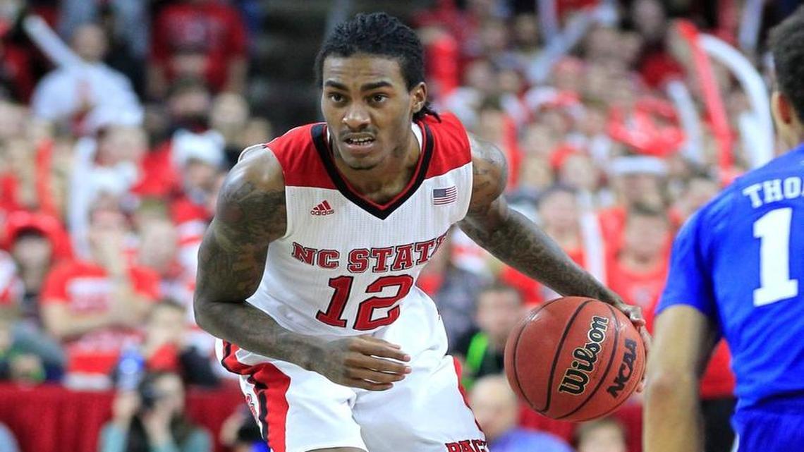 N.C. State's Cat Barber (12) winces after Barber was injured during the second half of Duke's 88-78 victory over N.C. State at PNC Arena in Raleigh Saturday, Jan. 23, 2016.