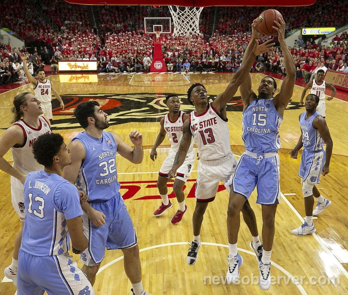 North Carolina’s Garrison Brooks (15) harnesses a defensive rebound over N.C. State’s C.J. Bryce (13) in the first half on Tuesday, January 8, 2019 at PNC Arena in Raleigh, N.C.