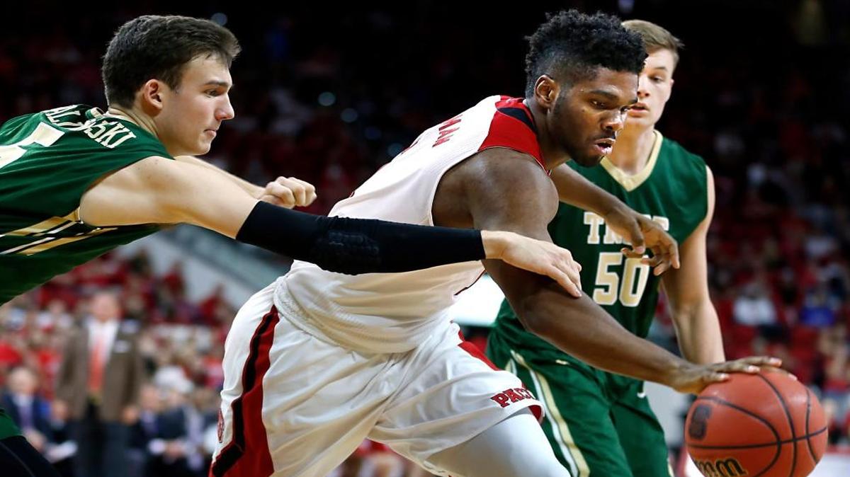 N.C. State's Lennard Freeman (1) pulls in the rebound as William & Mary's Greg Malinowski (5) trails during the first half of the Wolfpack's game against William & Mary at PNC Arena in Raleigh, N.C., Friday, Nov. 13, 2015.