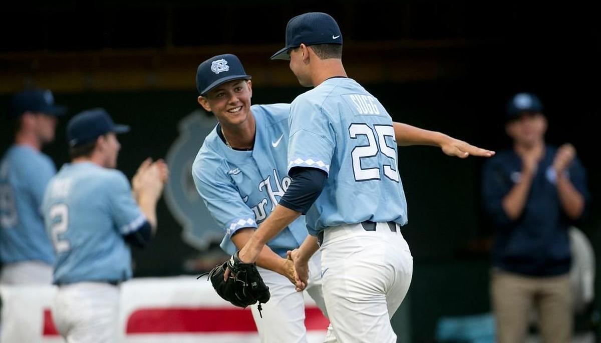 North Carolina’s Utah Jones, left, congratulates pitcher Taylor Sugg, right, during their NCAA regional game on June 4.