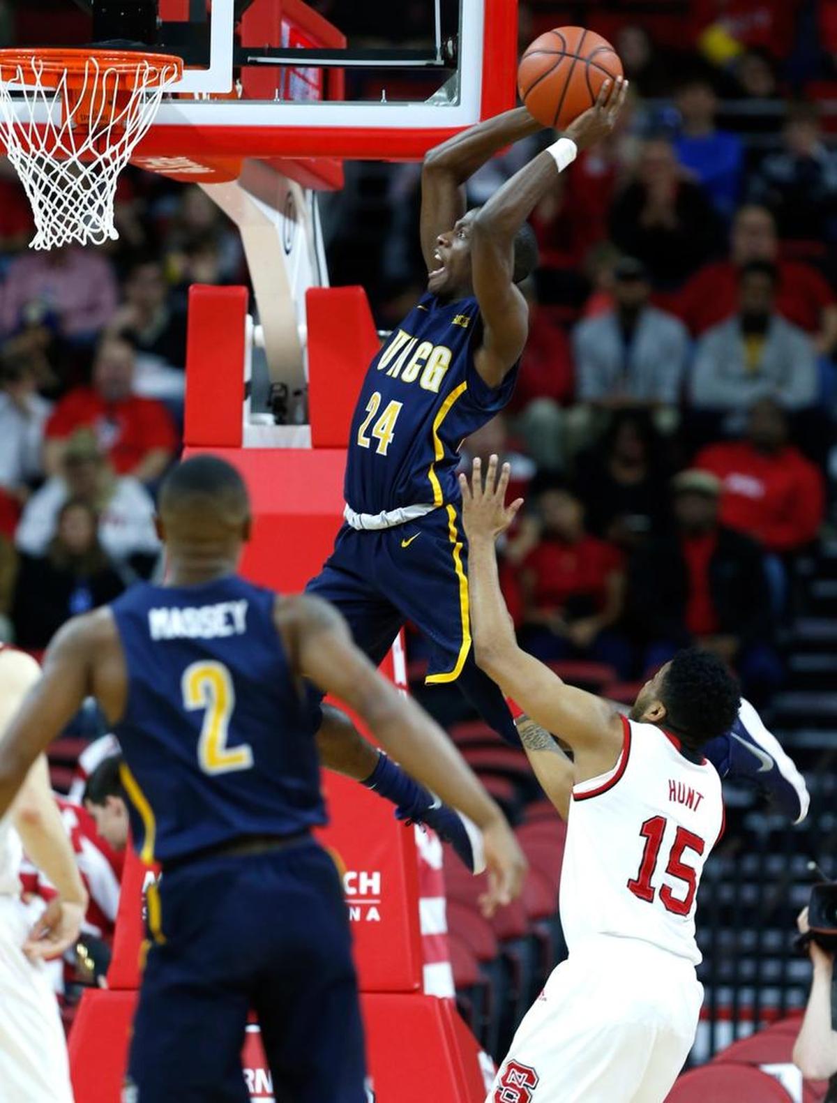 UNC Greensboro's Isaiah Miller (24) heads in to slam in two during UNCG's 81-76 victory over N.C. State.
