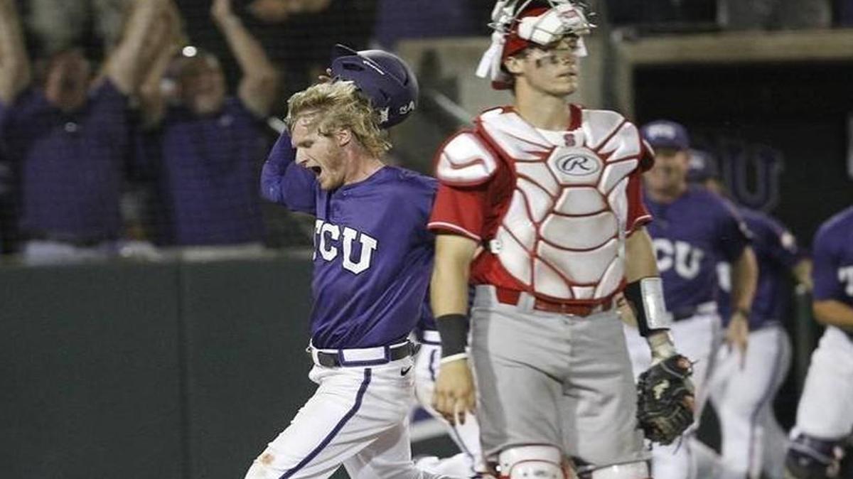 TCU's Evan Williams scores the winning run off a single by teammate Elliott Barzilli as N.C. State catcher Andrew Knizner (11) walks off in the tenth inning at the Fort Worth Regional of the NCAA college baseball tournament. TCU won 9-8. Tim Sharp AP