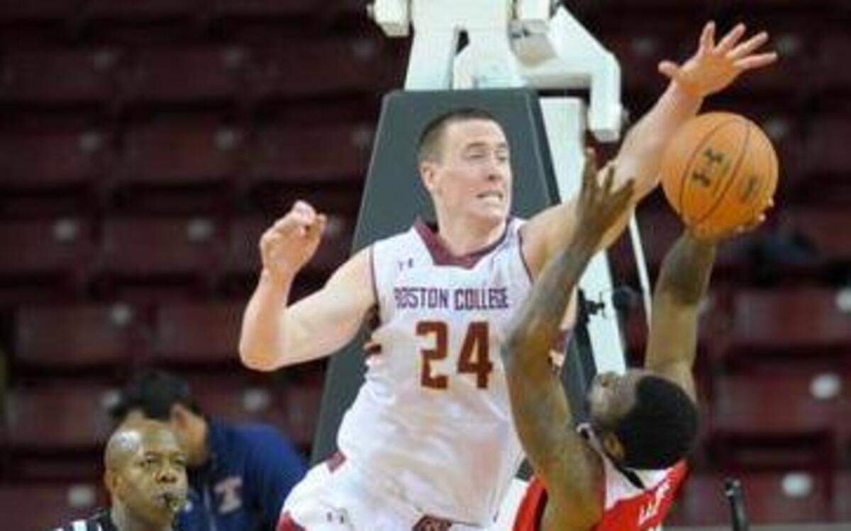 
Boston College Eagles center Dennis Clifford (24) blocks the shot of North Carolina State Wolfpack guard Desmond Lee (5) during the second half at Silvio O. Conte Forum. 
