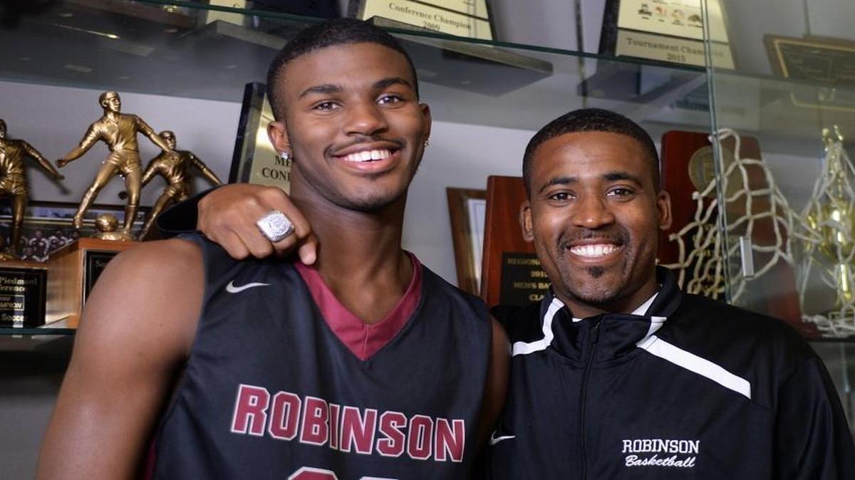 Concord Robinson's Lavar Batts Jr., left, with his father Lavar Batts Sr., has signed with N.C. State