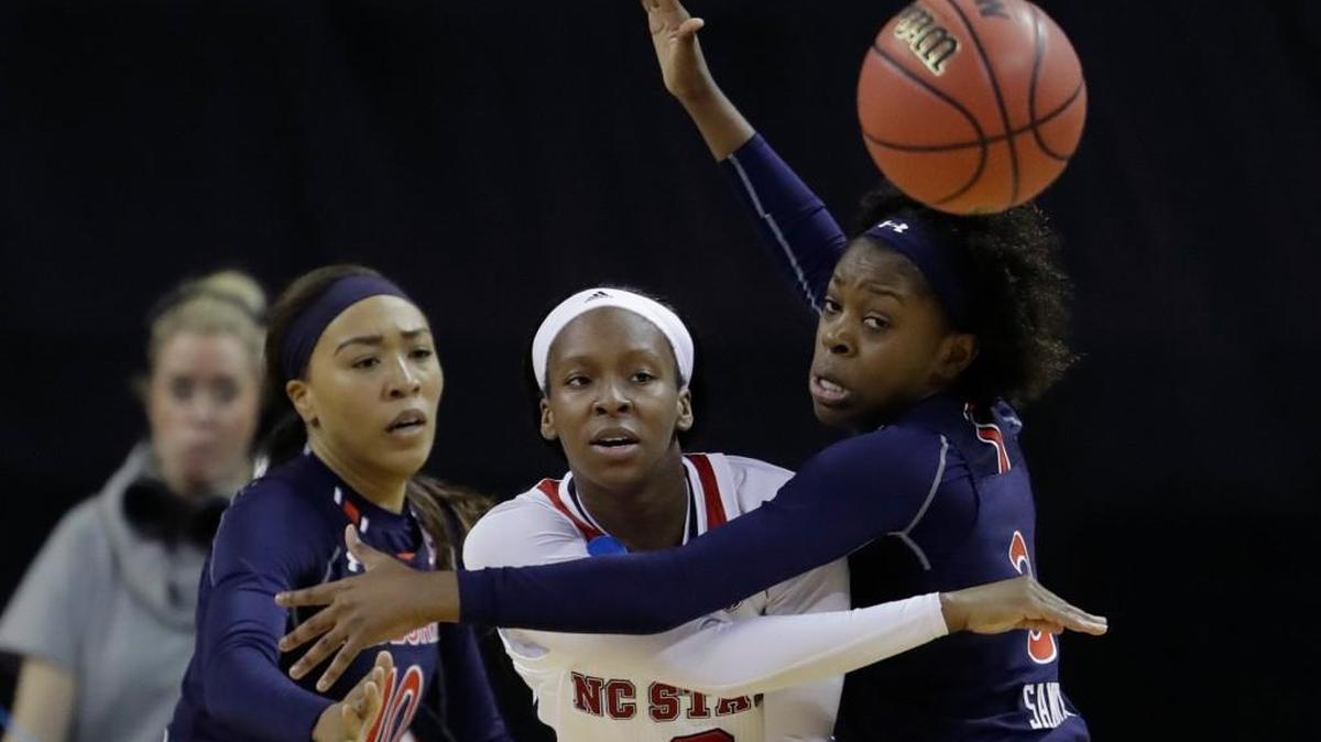 N.C. State guard Kaila Ealey (2) passes the ball past Auburn defenders Brandy Montgomery (10) and Erica Sanders (3) during the Wolfpack’s 62-48 NCAA first-round win over the Tigers on Friday.