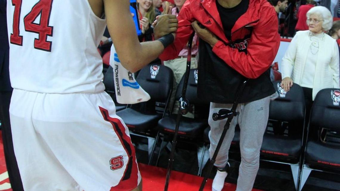 N.C. State's Caleb Martin (14) is congratulated by Terry Henderson after N.C. State's 88-70 victory over South Alabama at PNC Arena in Raleigh, N.C., Sunday, Nov. 15, 2015.