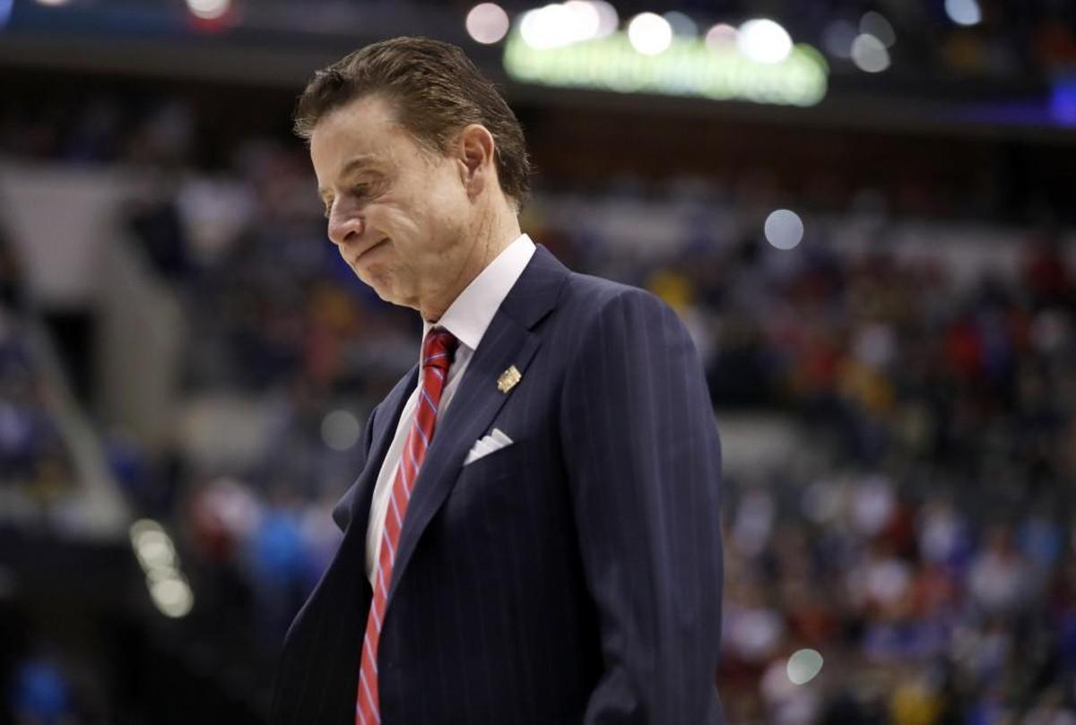 Louisville head coach Rick Pitino walks off the court after a 73-69 loss to Michigan in March. Pitino was fired earlier this month after an FBI investigation into college basketball.