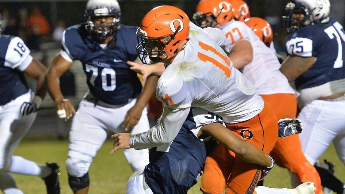 Hillside’s Brendon Edgerton (32) tackles Orange’s Payton Wilson (11) during the fourth quarter.The Orange Panthers visited the Hillside Hornets in a high school football game on Oct. 13, 2017.