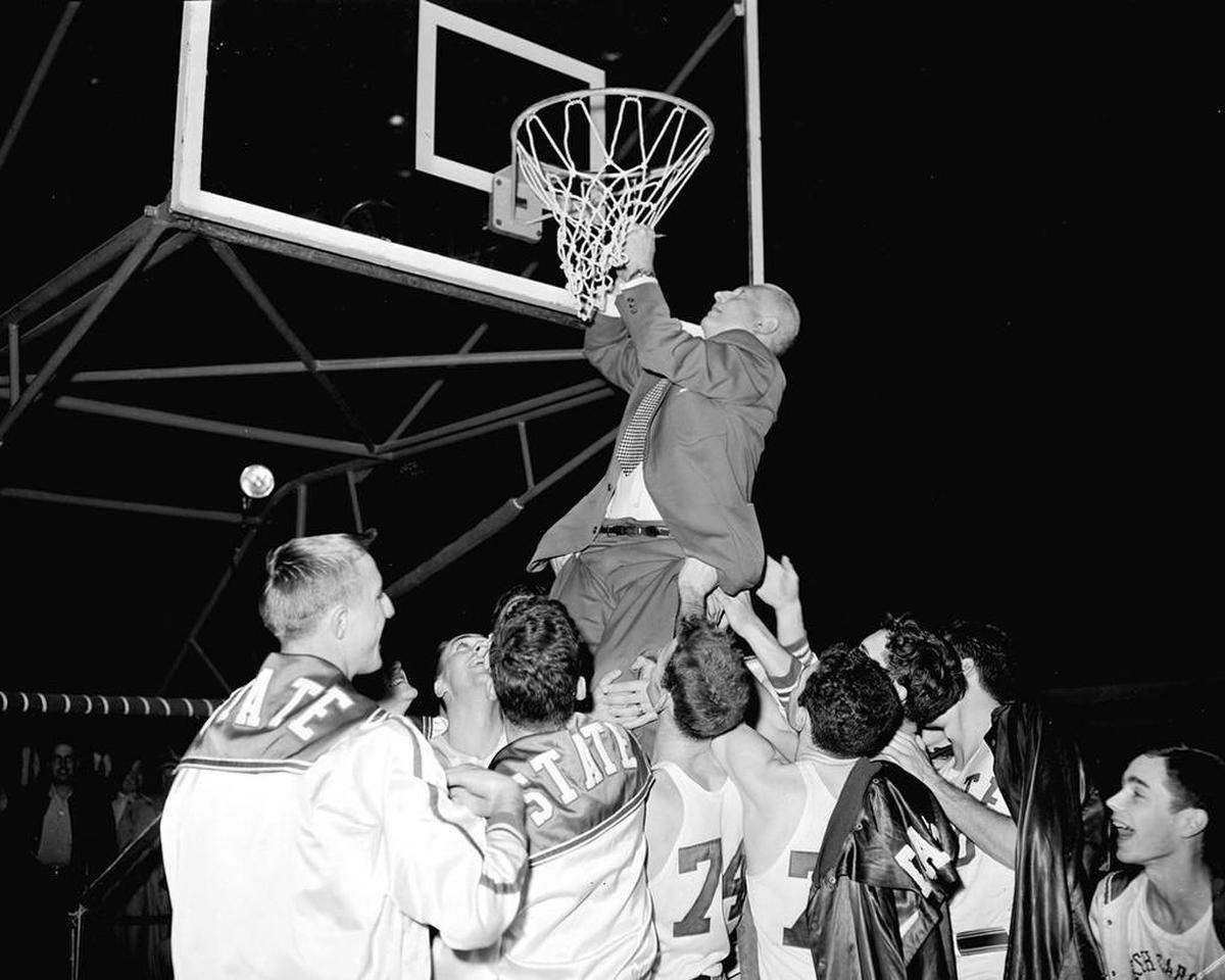 Everett Case and his N.C. State team celebrate the first ACC championship on March 15, 1954.